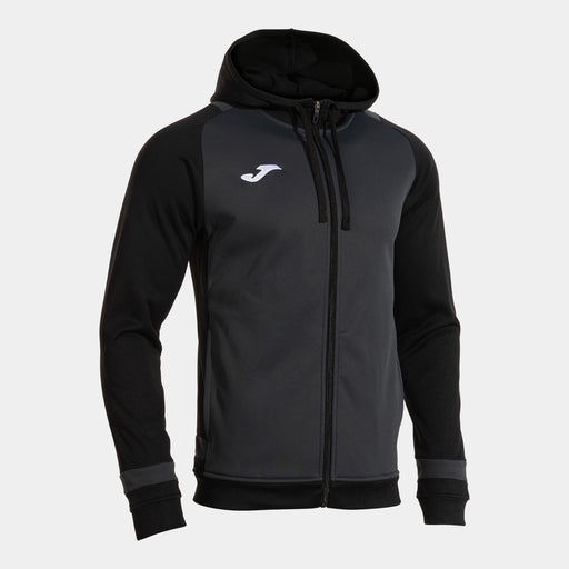 A hooded jacket with long sleeves, predominantly dark gray in color with black sleeves, featuring a front zipper and the Joma brand logo on the hood.