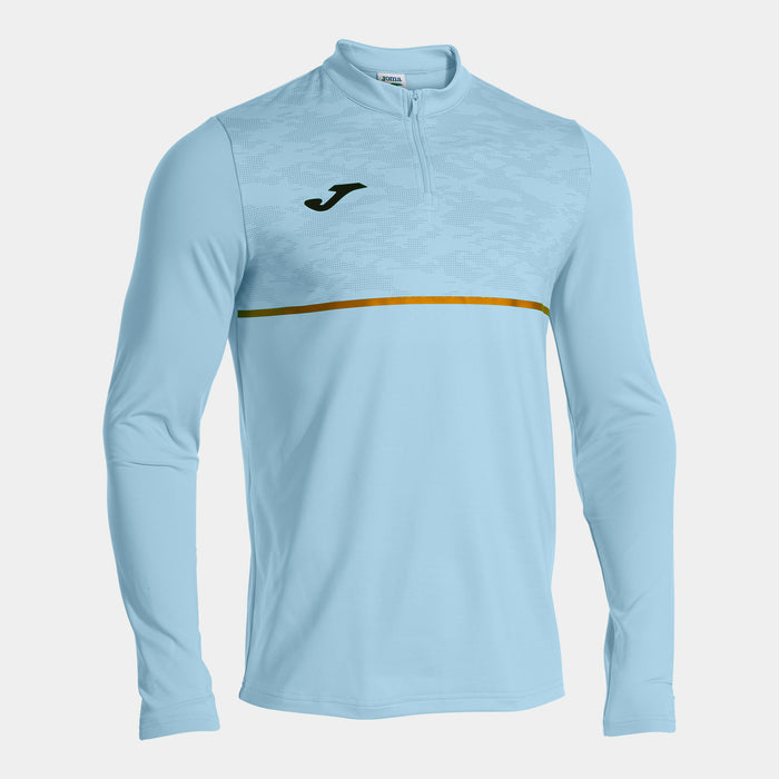 A sky blue long-sleeved Joma sweatshirt with a 1/4 zip closure and a golden yellow horizontal stripe on the chest.