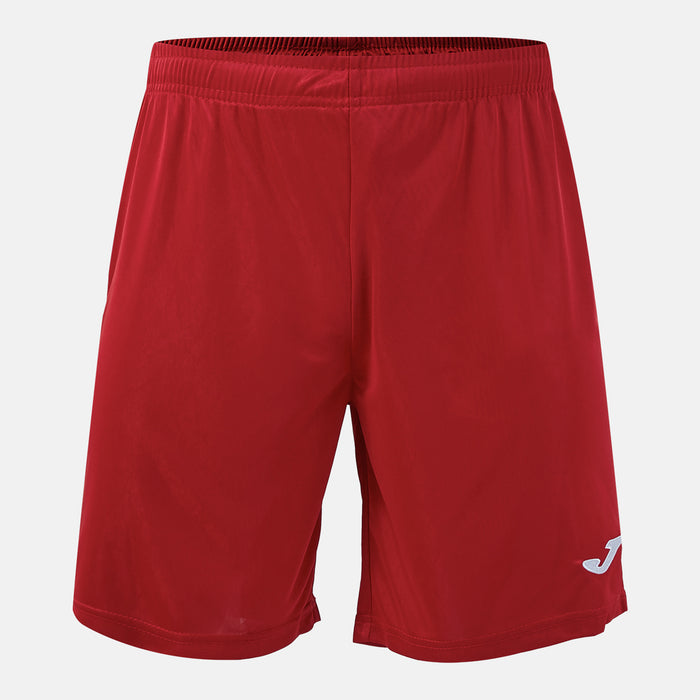 Red shorts with a brand logo on a light gray background
