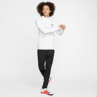White nike 1/4 zip track jacket with Nike Park 20 Knit Pant in black with white nike trainers