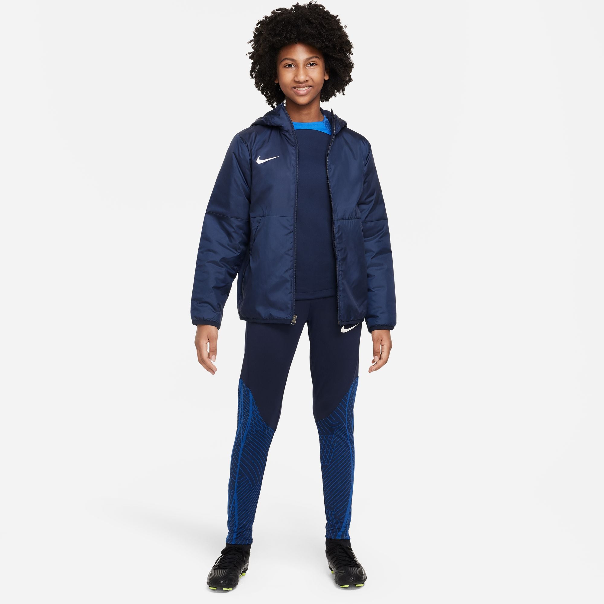 Boy wears Nike Team Park 20 Fall Jacket in Blue