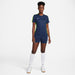 Nike Dri FIT Academy 23 Womens Short Sleeve Shirt in Obsidian and Volt with obsidian nike shorts and white nike socks and white nike trainers