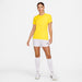 Nike Dri FIT Academy 23 Womens Short Sleeve Shirt in Tour Yellow/University Gold with white nike shorts and white nike socks and white nike trainers