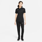 Nike Dri FIT Academy 23 Women's Short Sleeve Polo in black with black nike tracksuit bottoms and black nike trainers