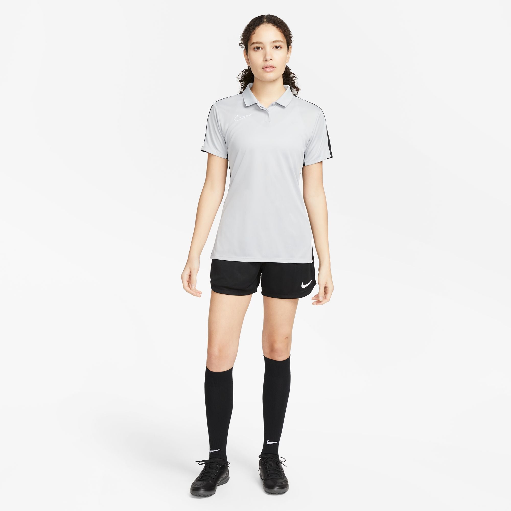 Nike Dri FIT Academy 23 Women's Short Sleeve Polo in Wolf Grey/Black with black nike shorts and black nike socks and black nike trainers