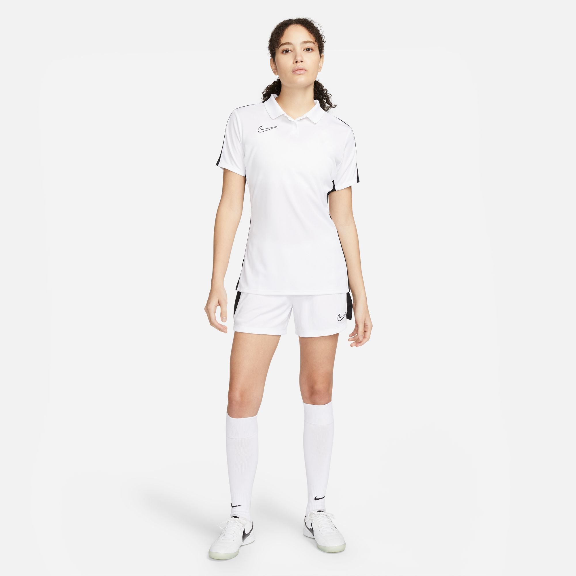 Nike Dri FIT Academy 23 Women's Short Sleeve Polo in White/Black with white nike shorts and white nike socks and white nike trainers