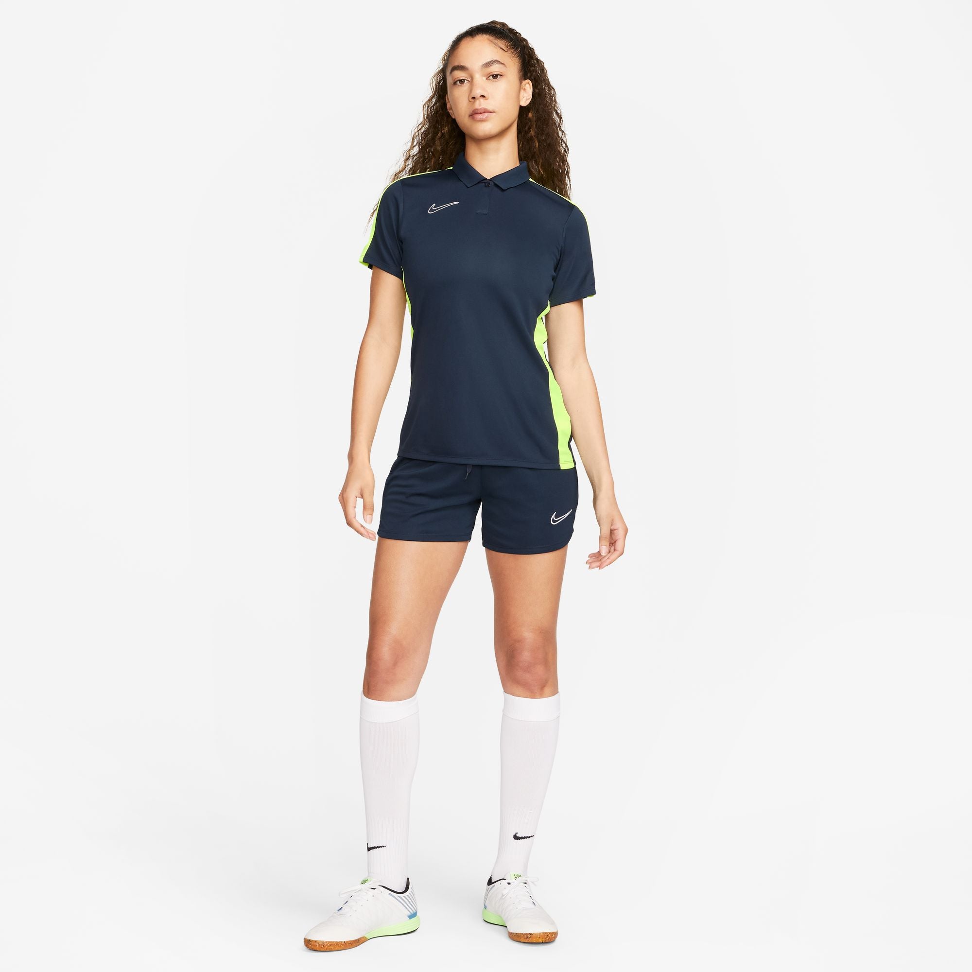 Nike Dri FIT Academy 23 Women's Short Sleeve Polo in Obsidian/Volt with obsidian nike shorts and white nike socks and white nike trainers