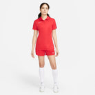 Nike Dri FIT Academy 23 Women's Short Sleeve Polo in University Red/Gym Red with nike red shorts and white nike socks and white nike trainers