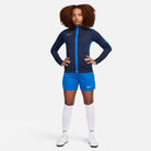 Nike Dri FIT Academy 23 Women's Knit Track Jacket in obsidian/royal blue with royal blue nike shorts and white nike socks and white nike trainers