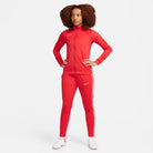 Nike Dri FIT Academy 23 Women's Knit Track Jacket in university red/gym red with red nike tracksuit bottoms and white nike trainers