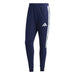 Navy blue Adidas tracksuit pants with white stripes on a white background