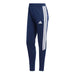 Navy blue Adidas tracksuit pants with white stripes on a white background
