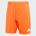 Orange shorts with Adidas logo on a light gray background
