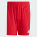 Red shorts with a white logo on a light gray background