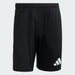 Black Adidas shorts on a light gray background