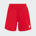 Red shorts with a white logo on a light gray background