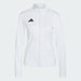 White jacket with Adidas logo on a light gray background