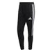 Black tracksuit pants with white stripes and Adidas logo on a white background