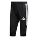 Black Adidas pants with three white stripes on a white background
