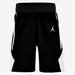 Black athletic shorts with a white logo on a light gray background